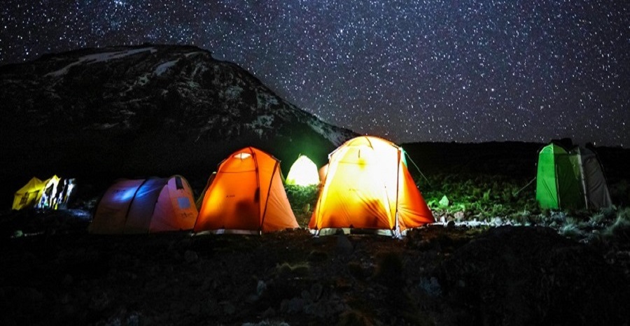 Light in tents at night after dinner; people get ready to sleep at Barranco Camp.