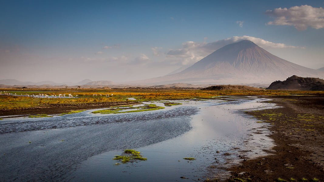 The dramatic, conical silhouette of Oldonyo Lengai, the 