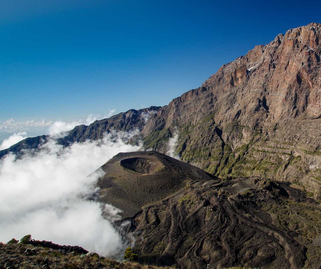 The rocky, high-altitude terrain of Karanga Camp on Mount Kilimanjaro, dotted with climber tents under a clear alpine sky.