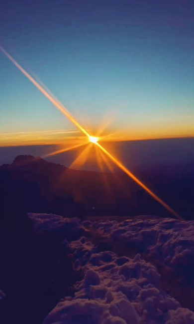The breathtaking sunrise over Mount Kilimanjaro, with the peak bathed in golden light. Instagram post